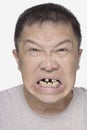 Angry Chinese man with bad teeth portrait