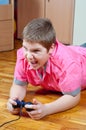 Angry chubby teenage boy playing computer games Royalty Free Stock Photo