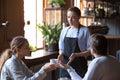 Angry client couple complain about bad service to waitress Royalty Free Stock Photo