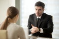 CEO asking female employee about reason of work delay Royalty Free Stock Photo