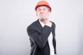 Angry contractor wearing hardhat making cutting neck gesture Royalty Free Stock Photo