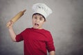 Angry cook child Royalty Free Stock Photo