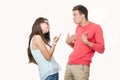 Angry couple arguing screaming to each other. Studio shot on white background. Discord in the relationship. Divergence Royalty Free Stock Photo