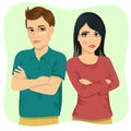 Angry couple looking at each other over shoulder and holding their arms crossed