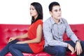 Angry couple sitting back to back Royalty Free Stock Photo