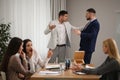 Angry coworkers quarreling at workplace Royalty Free Stock Photo