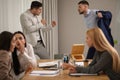 Angry coworkers quarreling at workplace in office Royalty Free Stock Photo