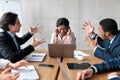 Angry Coworkers Shouting At Female Colleague During Meeting In Office Royalty Free Stock Photo