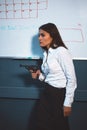 Angry crazy businesswoman with gun in office. Business crisis concept. Weapons concept. Tinted image