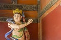 Angry Crowned Buddha Statue with Spear and Blue Sash