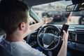 Angry and discontent driver showing with his hand to the traffic jam ahead his car. Aggressive and dissatisfied guy unsafe driving Royalty Free Stock Photo