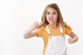 Angry displeased and distressed hateful blond little girl, child staring furious and upset, complaining, grimacing Royalty Free Stock Photo