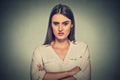 Angry displeased woman on gray background Royalty Free Stock Photo