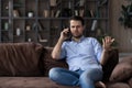 Angry dissatisfied man talking on phone, arguing or solving problem Royalty Free Stock Photo