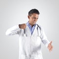 Angry doctor hiting hand with tension