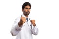 Angry doctor showing fists