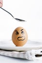 An Angry egg look up at spoon Royalty Free Stock Photo