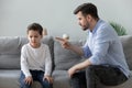 Angry father scolding sad kid son for bad behavior Royalty Free Stock Photo
