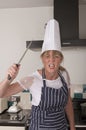 Angry female chef holding a knife Royalty Free Stock Photo