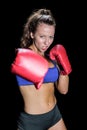 Angry female fighter with gloves Royalty Free Stock Photo