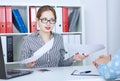 Angry female manager listening to emotional female boss holding documents, pointing at papers. Dispute or argument Royalty Free Stock Photo
