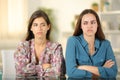 Angry friends ignoring each other at home Royalty Free Stock Photo