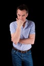 Angry Frowning Man Glaring over Hand on Chin Royalty Free Stock Photo