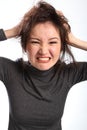 Angry and frustrated woman pulls her hair out Royalty Free Stock Photo