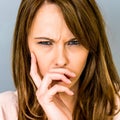 Angry Frustrated Young Woman Frowning In Disagreement Royalty Free Stock Photo