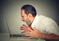 Angry furious business man screaming at computer Royalty Free Stock Photo