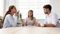 Angry furious female boss scolding employees for bad work