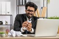 Angry furious man working at home office throwing crumpled paper, having nervous breakdown at work Royalty Free Stock Photo