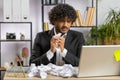Angry furious man working at home office throwing crumpled paper, having nervous breakdown at work Royalty Free Stock Photo