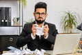 Angry furious man working at home office throwing crumpled paper, having nervous breakdown at work Royalty Free Stock Photo