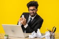 Angry furious man working at home office throwing crumpled paper, having nervous breakdown at work Royalty Free Stock Photo