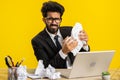 Angry furious man working at home office throwing crumpled paper, having nervous breakdown at work Royalty Free Stock Photo