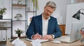 Angry furious man working at home office throwing crumpled paper, having nervous breakdown at work Royalty Free Stock Photo