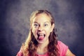 Angry girl with blond hair and pink shirt Royalty Free Stock Photo