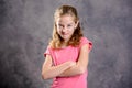 Angry girl with blond hair and pink shirt Royalty Free Stock Photo