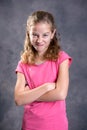 Angry girl with blond hair and pink shirt Royalty Free Stock Photo