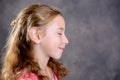 Angry girl with blond hair and pink shirt Royalty Free Stock Photo