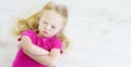 Angry girl lying on white wooden floor Royalty Free Stock Photo