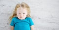 Angry girl lying on white wooden floor Royalty Free Stock Photo