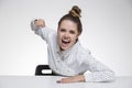 Angry girl in polka shirt hitting the air Royalty Free Stock Photo