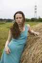 Angry girl standing near haystack Royalty Free Stock Photo