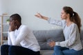 Angry girlfriend blaming African American boyfriend, relationship problem