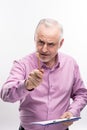 Angry grey-haired man pointing with pencil threateningly Royalty Free Stock Photo