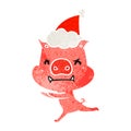 angry hand drawn retro cartoon of a pig wearing santa hat