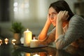 Angry homeowner using candles during power outage Royalty Free Stock Photo