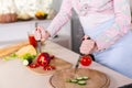 Angry housewife on kitchen with two knifes Royalty Free Stock Photo